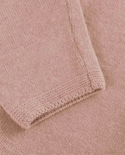 En Fant strikket bukse til baby - adobe rose